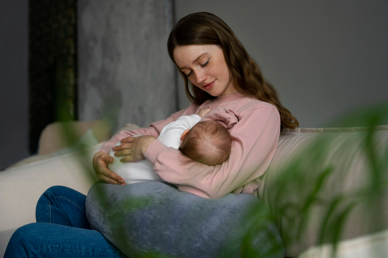 woman breastfeeding at home