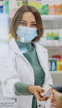 woman pharmacist helping customer