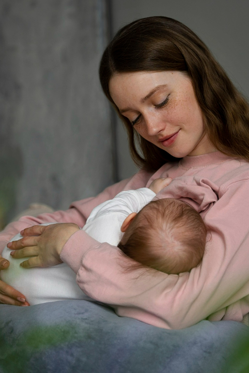 woman breastfeeding baby