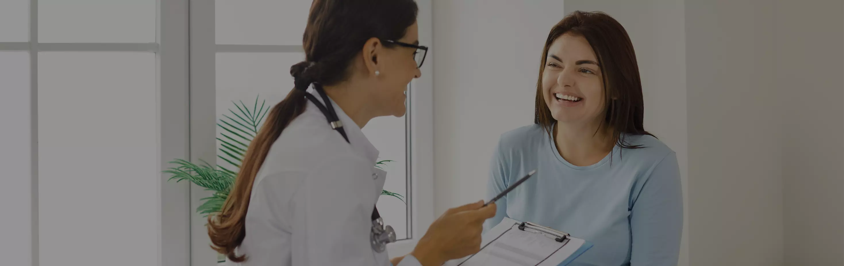 doctor meeting with female patient