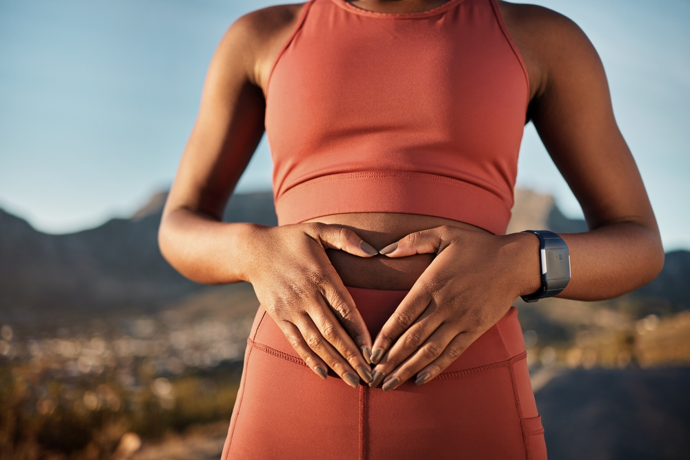 woman holding healthy gut