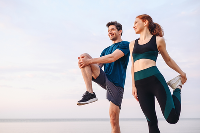 man and woman exercising together