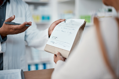 pharmacist giving patient meds